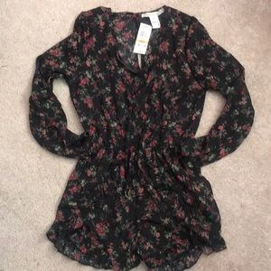 Small long sleeve romper with tags! Never worn.